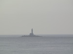 SX03051 Silhouette of Lighthouse near Rosslare on rocky outcrop.jpg